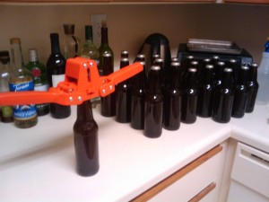 Capping the bottles, one at a time.